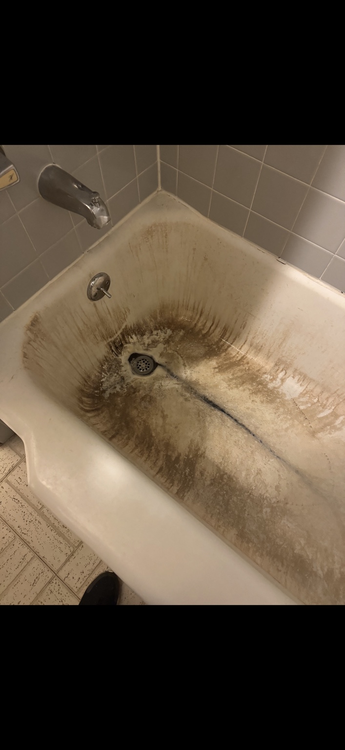 Old stained tub and shower before remodel