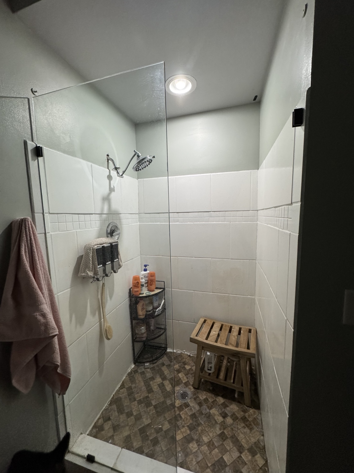 White tile walk-in shower before remodel