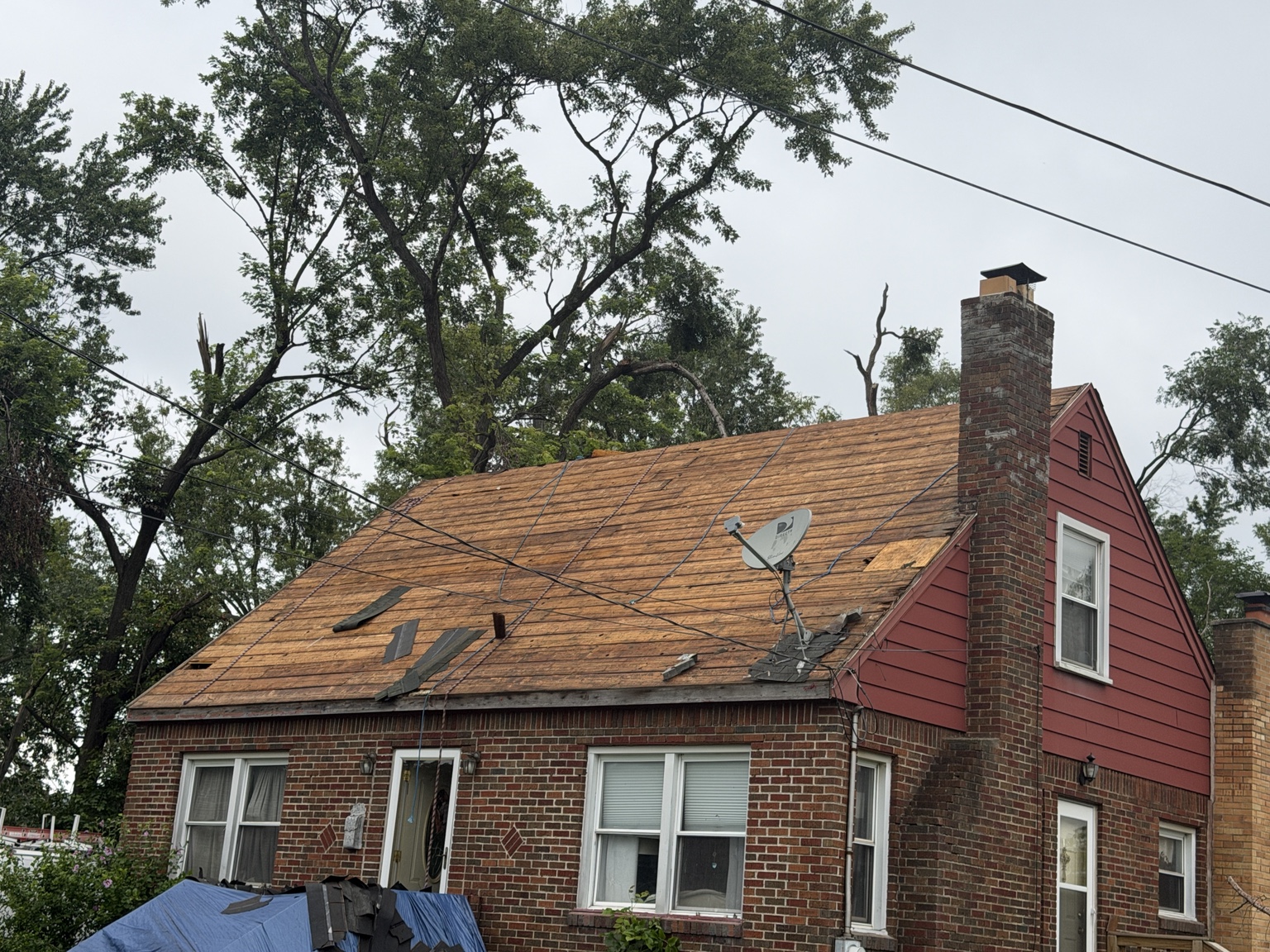 Front of the house during roof tear-off